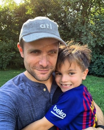 Picture of Neil Hopkins playing with his son Alex Hopkins